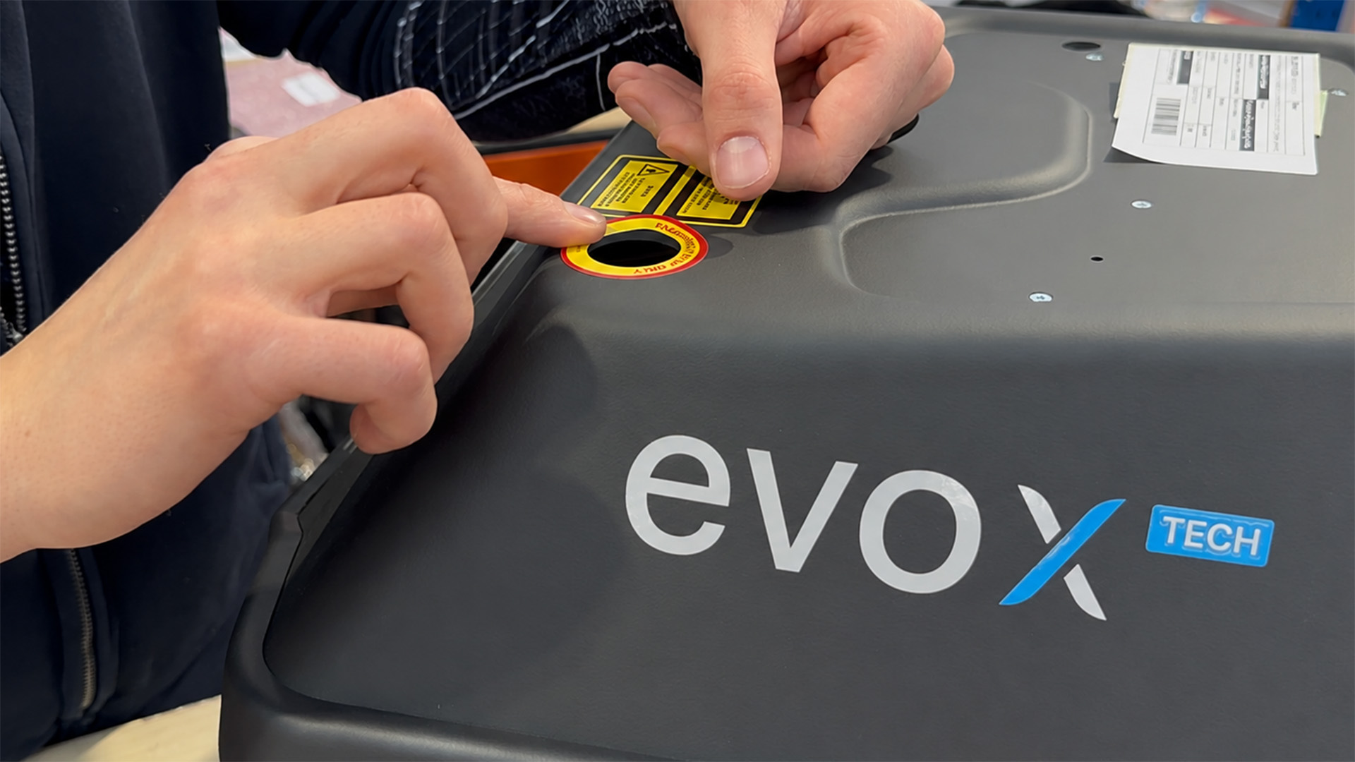 Application of safety labels on the Orotig Evo X Tech laser welding machine