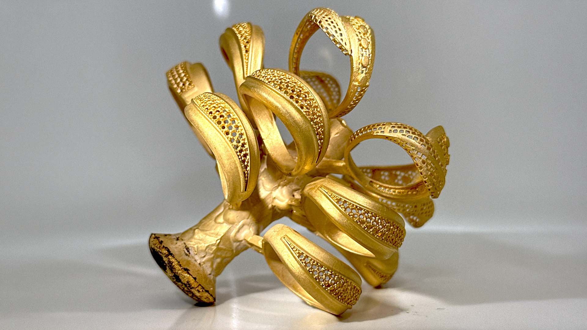 Gold casting tree created with Prometheus casting machine, close-up of band rings.